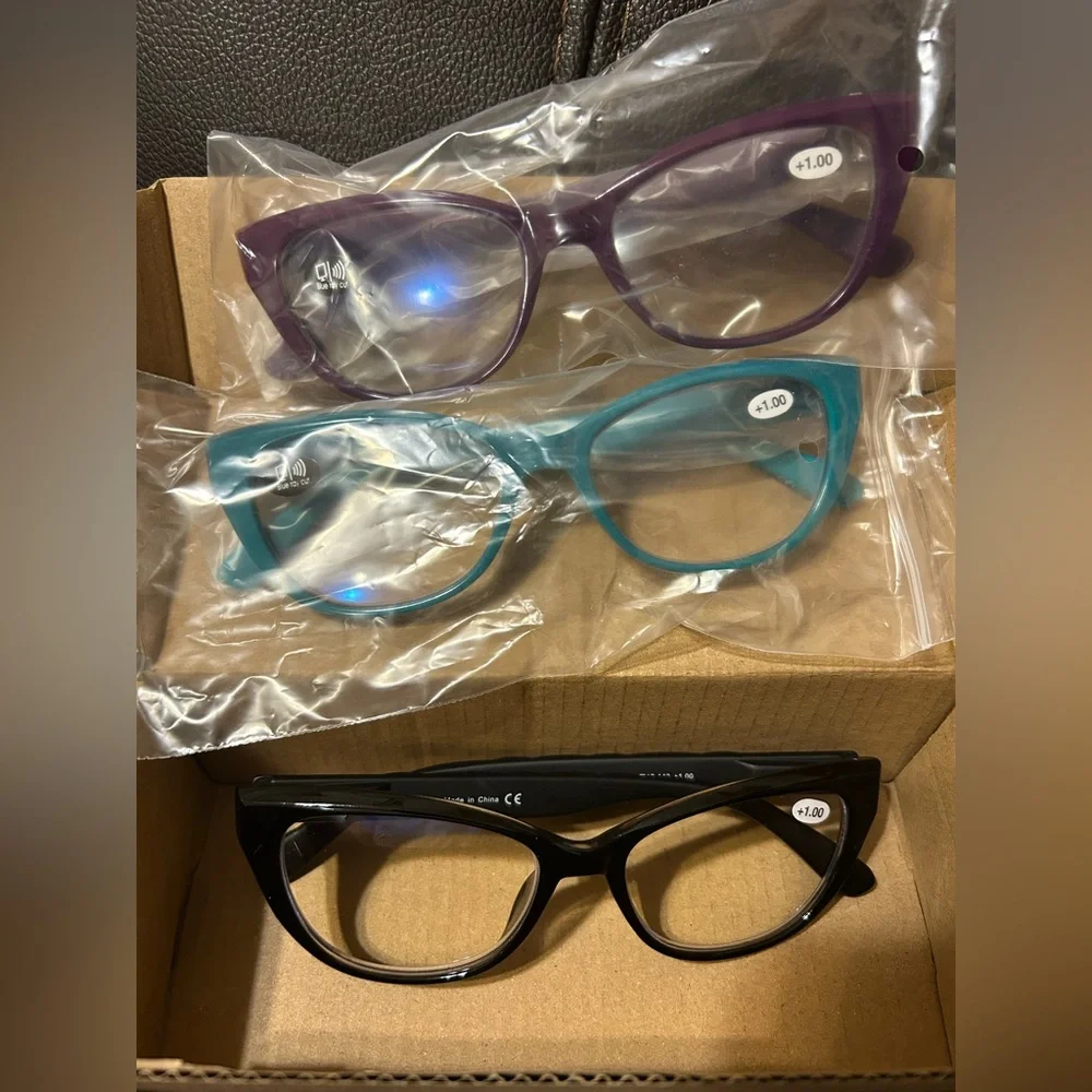 Reading glasses. 1.00.‎ Black, Teal and Purple. Brand new, in box.